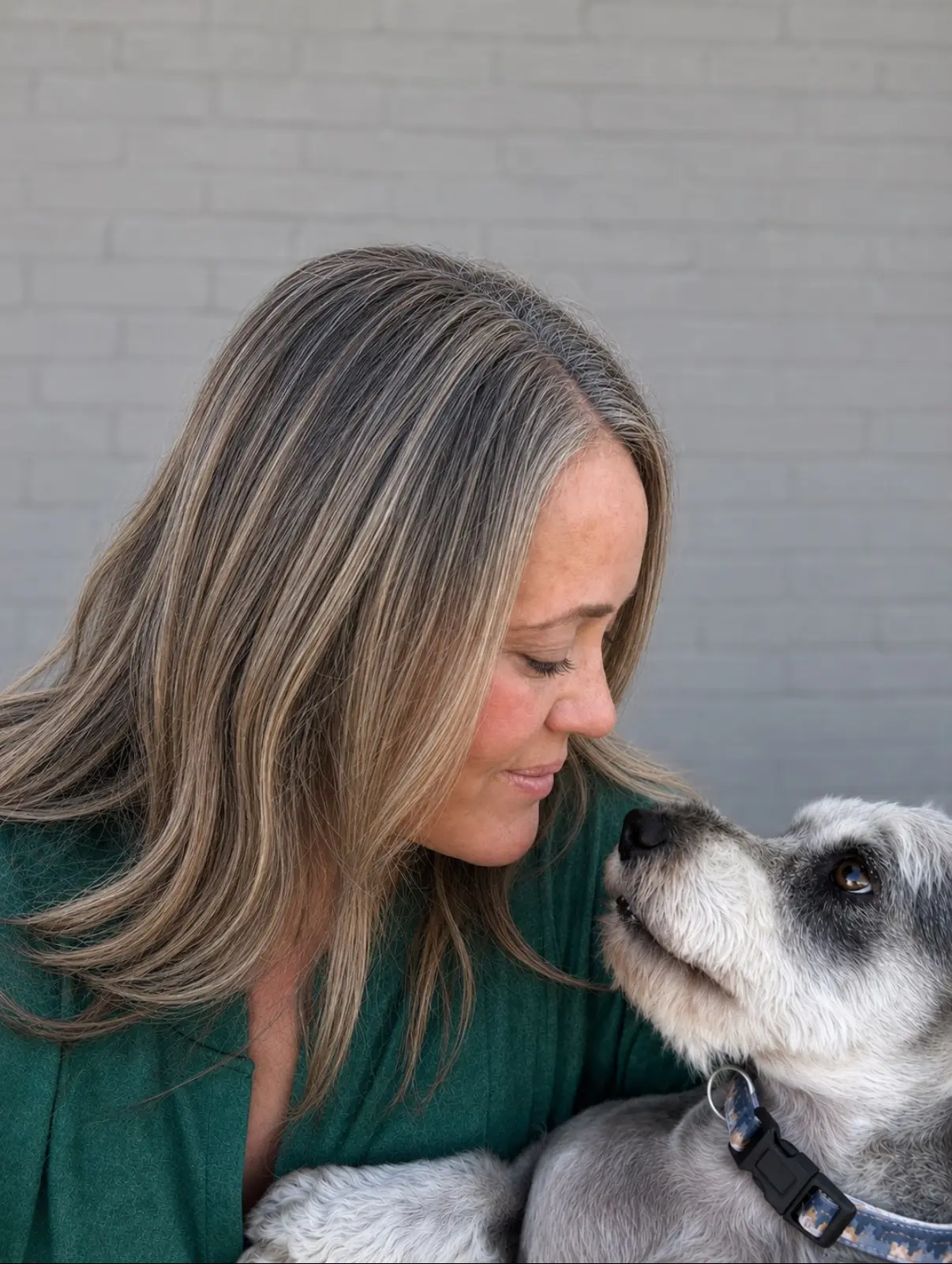 Reina McRae sharing a quiet moment with one of the rescue's dogs