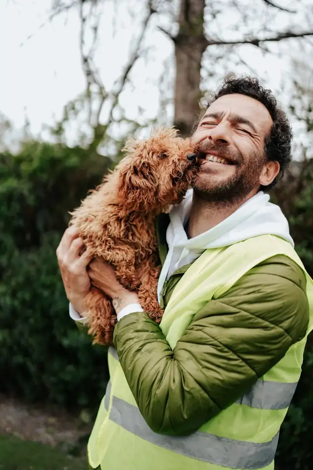 dog giving kisses to a person